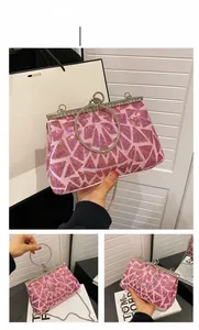 Detailed view of pink evening bag with vintage metal clasp and shimmering sequins