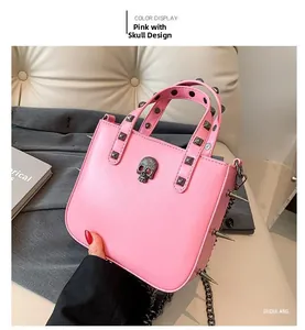 Pink punk handbag featuring silver skull relief with metal rivets and edgy spikes detail