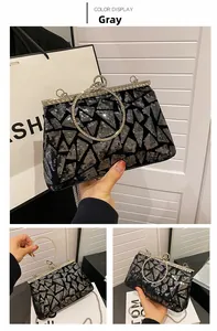 Detail of grey sequin evening bag featuring geometric patterns and diamond-encrusted clasp