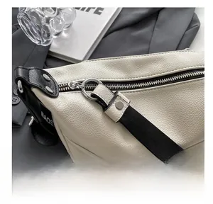 Detail of white litchi pattern leather bag featuring high-quality silver ring zipper