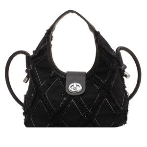 Quilted denim crescent crossbody bag with frayed edges and silver turn-lock closure