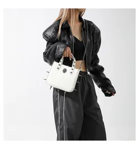 White leather punk tote with silver skull, studs, and spiked metal side details