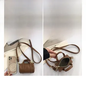 Brown leather mini Boston bag size comparison with smartphone and interior view