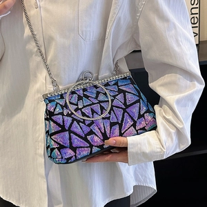 Sparkling sequin clutch bag with geometric pattern and silver ring handle for evening gala