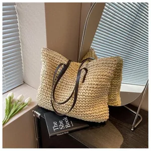 Detailed texture of woven straw tote bag with brown leather handles and interior scene