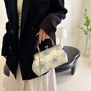 Vintage evening bag with blue floral embroidery, kiss-lock closure and metal chain strap
