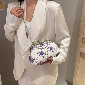 Elegant white hand-embroidered floral evening clutch bag with silver chain and metal clasp