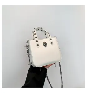 Gothic white leather handbag featuring metal skull ornament and punk style silver rivets
