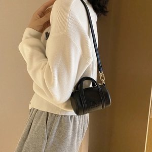 Chic black litchi pattern leather mini cylinder bag for women with golden hardware