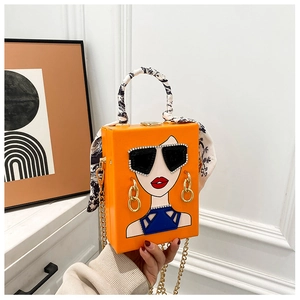 Detail der orangefarbenen Handtasche mit Mode-Illustration, Seidentuch und Goldkette