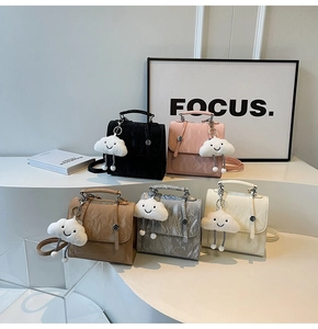 Detailed display of French style mini backpacks in five colors with cloud charms