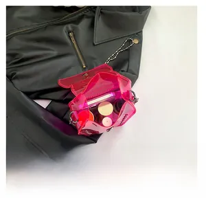 Detailed view of pink transparent PVC rivet bag showing internal storage capacity
