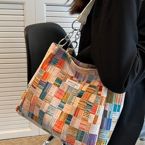 Large plaid tote bag with colorful patchwork design and silver chain strap for women