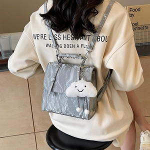 Silver wrinkled patent leather backpack with cloud charm and adjustable thin straps