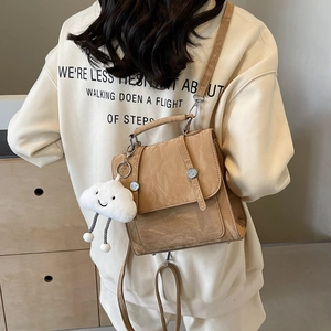 Minimalist beige pleated shoulder bag with cute white cloud pendant and metal hardware