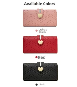 Detail view of quilted leather wallets with heart hardware in pink, red, and black colors