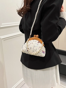 Elegant white embroidered butterfly bag with wooden clasp and pearl chain shoulder straps