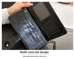 Detail view of black vintage oil wax leather wallet with multiple card slots and wrist strap