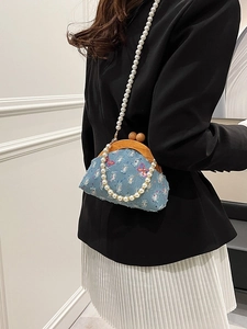 Blue denim crossbody bag with pearl strap, wood clasp and sequined butterfly embroidery