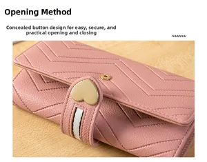 Pink PU leather wallet detail showing V-shaped quilting and golden heart metal buckle