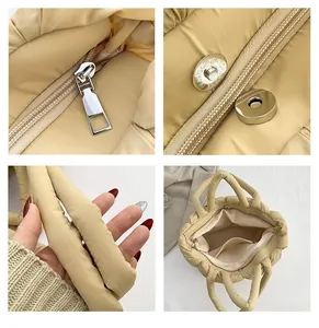 Detail view of quilted puffer tote bag with secure zipper and metal magnetic buckle