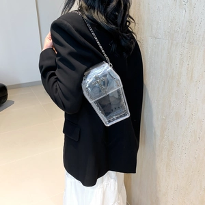 Transparent coffin-shaped crossbody bag with silver studs, cross charm and chain strap