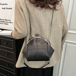 Chic black shell bag with crossbody chain strap and vintage clasp closure detail