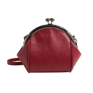 Vintage burgundy shell-shaped crossbody bag with metal frame and double ball clasp