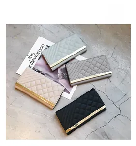 Detailed view of quilted long wallets for women in four colors with gold metal trim accents