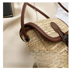 Close-up of woven straw texture with premium brown leather piping and precise stitching