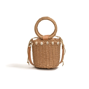 Straw bucket bag with shell charms, wooden ring handle and leather shoulder strap