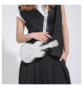 Close-up of a silver mirror PU guitar-shaped crossbody bag with metallic rivet accents