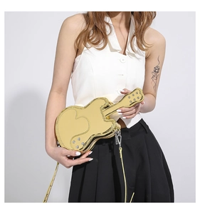 Macro detail of violin-shaped crossbody bag featuring bright yellow finish and rivet accents