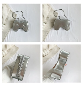 Detailed views of silver game controller shaped chain bag with metallic PU texture