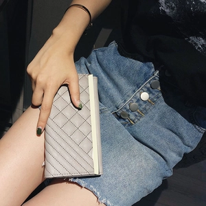 Elegant grey quilted long wallet for women with decorative gold metal trim and PU leather finish