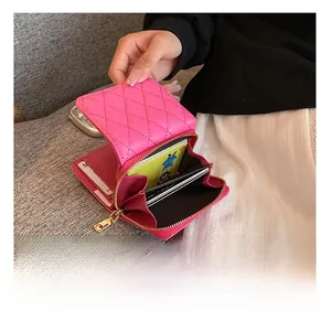 Internal view of pink quilted wallet showing large capacity compartments and card slots