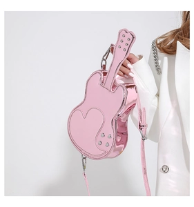 Macro view of metallic pink violin shaped bag with heart stitching and silver rivets