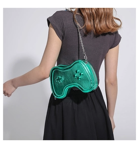 Creative green game controller crossbody bag shown on model for size perspective