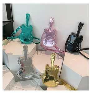 Five creative violin-shaped crossbody bags in metallic colors with rivet details