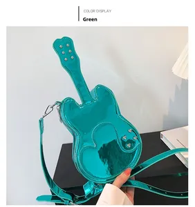 Detail of creative violin-shaped green shoulder bag with glossy finish and heart decor