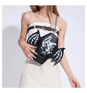 Detail of coffin-shaped gothic crossbody bag with bat wings and metal chain strap