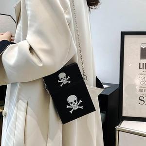 Fashionable black crossbody phone bag with white skull prints and silver metal chain strap