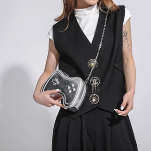 Silver game controller shaped crossbody bag with metallic chain and creative joystick design