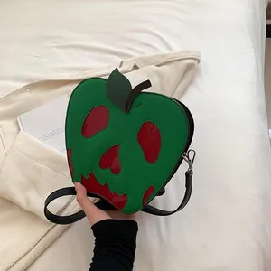 Detail of creative poisoned apple crossbody bag with skull design for Halloween fashion
