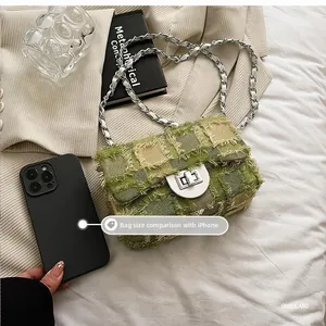 Quilted tweed crossbody bag size comparison with an iPhone showing compact dimensions
