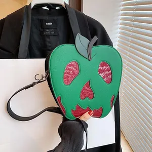 Macro shot of green lychee leather texture on a skull-shaped poison apple shoulder bag