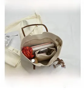 Interior view of large tote bag showing space for tablet, umbrella and makeup