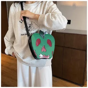 Detailed view of Poison Apple crossbody bag with skull texture and adjustable strap