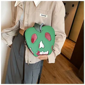 Detail of poisonous apple crossbody bag with skull mirror patch for Halloween outfits