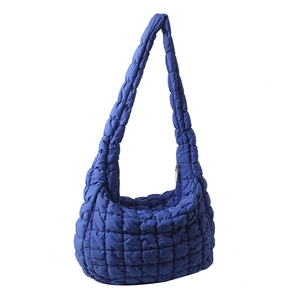 Deep blue quilted cloud shoulder bag with puffy padded texture and zipper closure